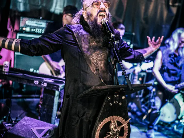 Vocalist screaming behind the coffin lectern, arms spread