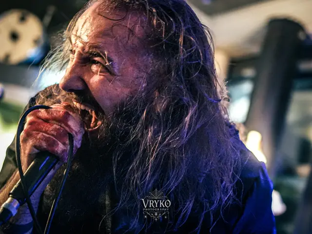 Close-up of the vocalist with a bloodied hand on the mic