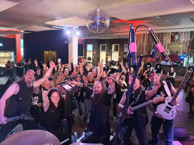 The band and the crowd throwing horns after the set
